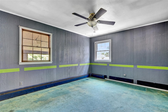 89 Circuit Rd, Bellport, NY 11713 - carpeted spare room with ceiling fan and wooden walls