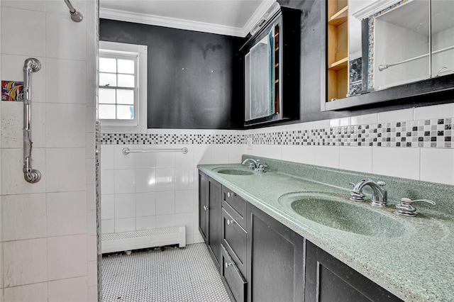 89 Circuit Rd, Bellport, NY 11713 - full bathroom with tile walls, crown molding, double vanity, baseboard heating, and tile patterned flooring