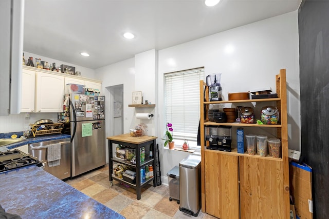 3046 Coddington Ave, Bronx, NY 10461 - kitchen featuring stainless steel appliances, light stone finish floors, white cabinets, dark countertops, and recessed lighting
