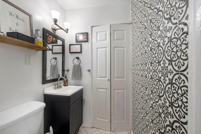 3046 Coddington Ave, Bronx, NY 10461 - bathroom with vanity, tile patterned floors, and a closet