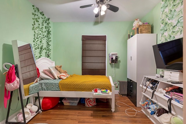 3046 Coddington Ave, Bronx, NY 10461 - bedroom featuring wood finished floors, a ceiling fan, and radiator heating unit