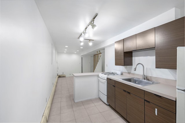 3046 Coddington Ave, Bronx, NY 10461 - kitchen featuring white appliances, light countertops, light tile patterned flooring, a peninsula, and rail lighting