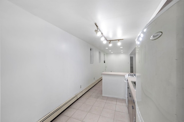 3046 Coddington Ave, Bronx, NY 10461 - empty room with light tile patterned floors and a baseboard radiator