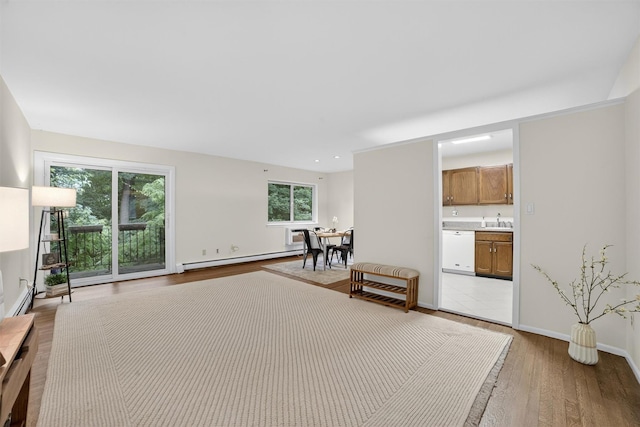 13 Scenic Unit J, Croton-On-Hudson, NY 10520 - sitting room with a baseboard heating unit and light wood-type flooring