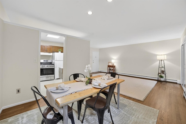 13 Scenic Unit J, Croton-On-Hudson, NY 10520 - dining room with light wood-style floors, recessed lighting, and a baseboard radiator