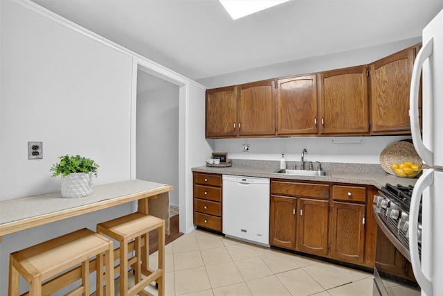 13 Scenic Unit J, Croton-On-Hudson, NY 10520 - kitchen featuring white appliances, brown cabinets, and light tile patterned flooring