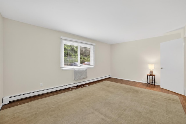 13 Scenic Unit J, Croton-On-Hudson, NY 10520 - unfurnished room with a baseboard radiator and wood finished floors