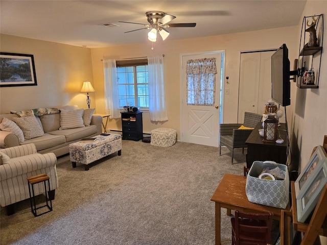 311 Woodbridge Dr Unit 311-C, Ridge, NY 11961 - carpeted living room featuring ceiling fan and a baseboard heating unit