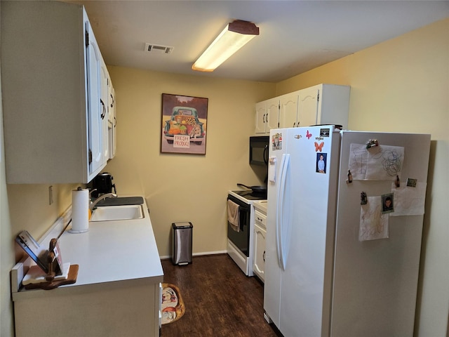 311 Woodbridge Dr Unit 311-C, Ridge, NY 11961 - kitchen featuring white appliances, dark wood-style floors, white cabinets, and light countertops