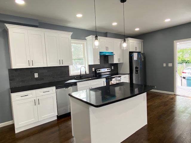6 Elbert St, Call Listing Agent, NY 12304 - kitchen featuring stainless steel appliances, dark wood-type flooring, white cabinetry, and recessed lighting