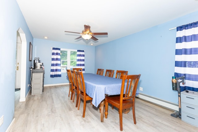 8 Division Ave, East Islip, NY 11730 - dining space featuring a baseboard heating unit, wood finished floors, and ceiling fan