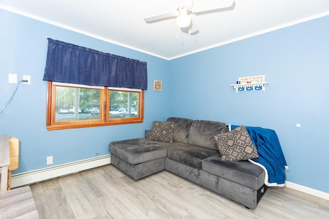8 Division Ave, East Islip, NY 11730 - living area featuring baseboard heating, wood finished floors, a ceiling fan, and ornamental molding
