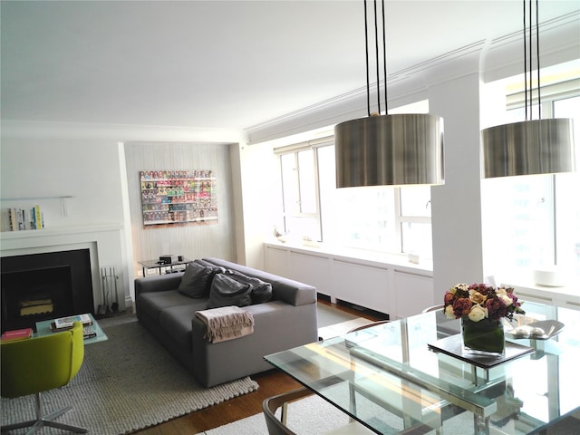 200 E 66th St Unit B1503, New York Manhattan, NY 10065 - living area featuring crown molding, plenty of natural light, a fireplace, and wood finished floors