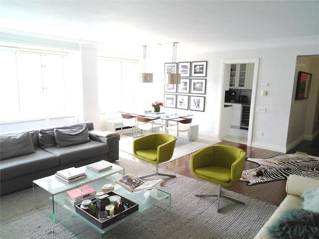 200 E 66th St Unit B1503, New York Manhattan, NY 10065 - living room featuring wine cooler, crown molding, and wood finished floors