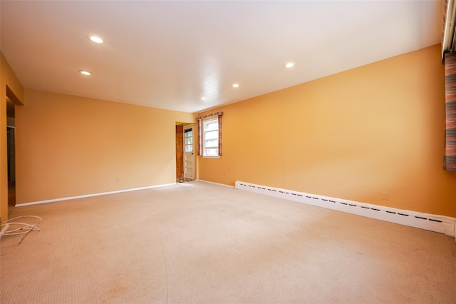 615 E Olive St, Long Beach, NY 11561 - spare room featuring baseboard heating, light carpet, and recessed lighting