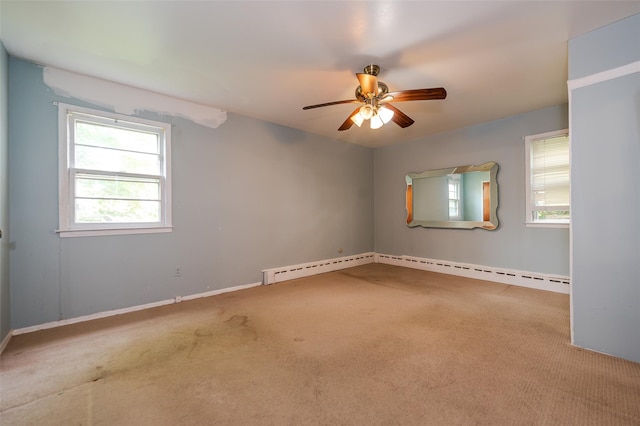 615 E Olive St, Long Beach, NY 11561 - unfurnished room featuring plenty of natural light, carpet floors, ceiling fan, and a baseboard heating unit
