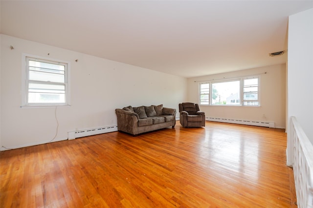 615 E Olive St, Long Beach, NY 11561 - living area with a baseboard heating unit and light wood-type flooring