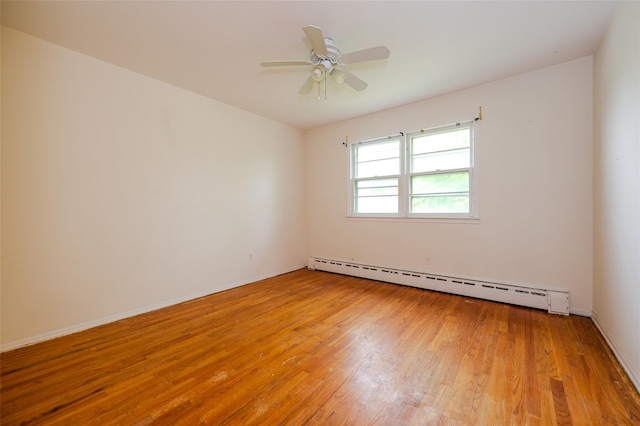 615 E Olive St, Long Beach, NY 11561 - empty room featuring a baseboard radiator, light wood-type flooring, and a ceiling fan