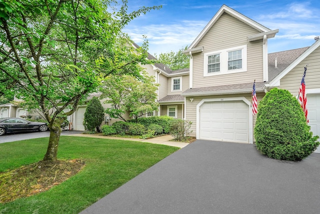 86 Erik Dr, East Setauket, NY 11733 - view of front of house with a front yard, driveway, a shingled roof, and an attached garage