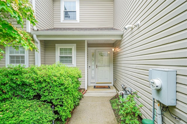 86 Erik Dr, East Setauket, NY 11733 - entrance to property with a shingled roof