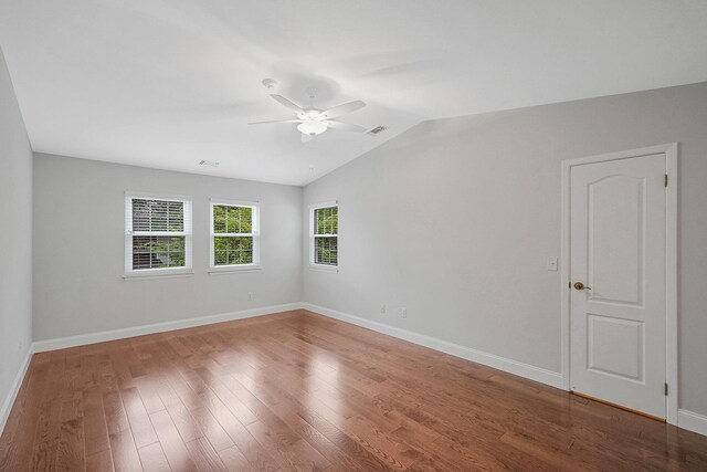 86 Erik Dr, East Setauket, NY 11733 - spare room featuring ceiling fan, vaulted ceiling, and wood finished floors