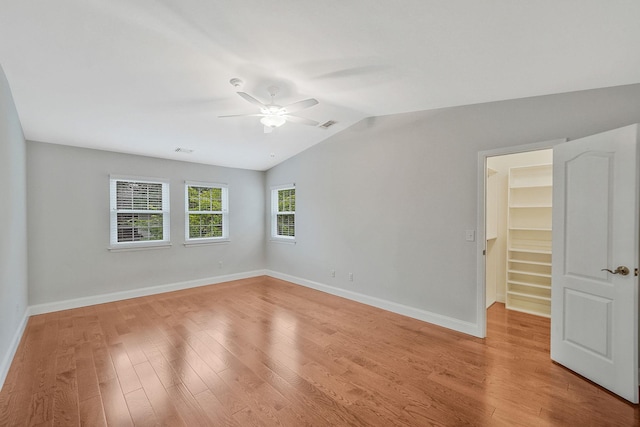 86 Erik Dr, East Setauket, NY 11733 - spare room featuring ceiling fan, lofted ceiling, and light wood-style floors