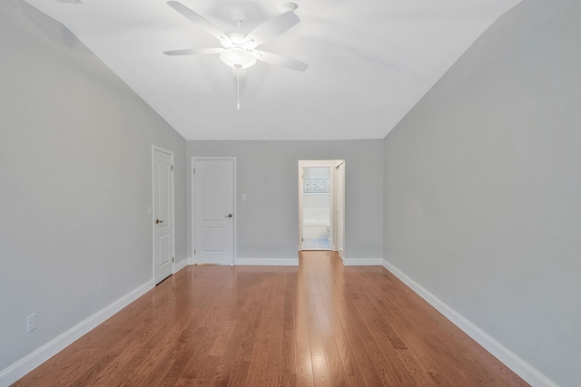 86 Erik Dr, East Setauket, NY 11733 - spare room with lofted ceiling, ceiling fan, and wood finished floors