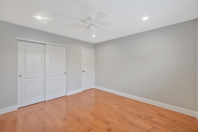86 Erik Dr, East Setauket, NY 11733 - unfurnished bedroom with a closet, light wood-style flooring, recessed lighting, and a ceiling fan