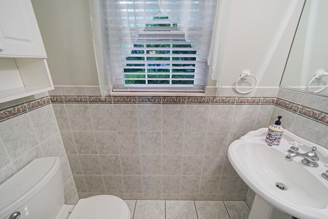 86 Erik Dr, East Setauket, NY 11733 - bathroom featuring tile walls and wainscoting