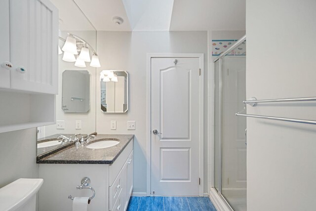 86 Erik Dr, East Setauket, NY 11733 - bathroom featuring a shower stall, vanity, and tile patterned flooring