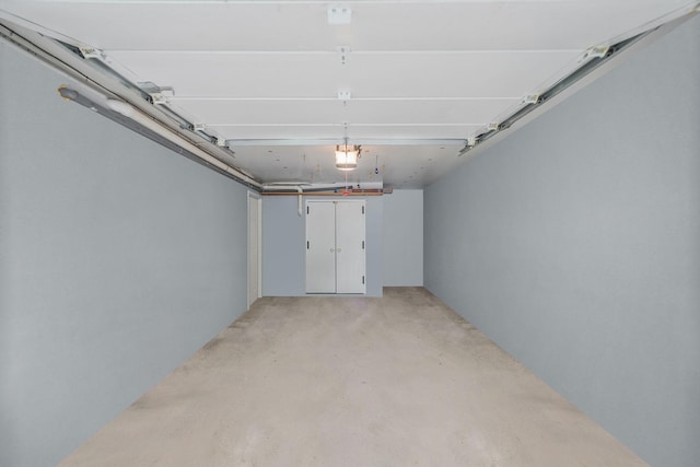 86 Erik Dr, East Setauket, NY 11733 - garage featuring a garage door opener