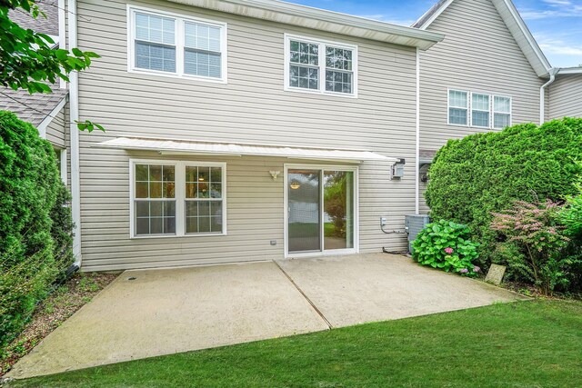 86 Erik Dr, East Setauket, NY 11733 - back of house featuring a patio and a lawn