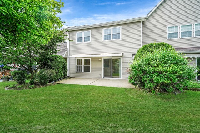 86 Erik Dr, East Setauket, NY 11733 - rear view of property featuring a patio area and a lawn
