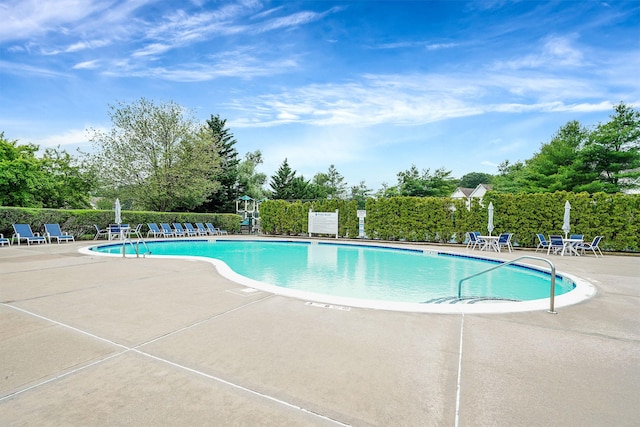 86 Erik Dr, East Setauket, NY 11733 - community pool with a patio area and view of scattered trees
