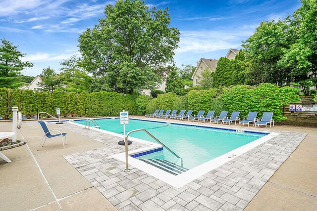 86 Erik Dr, East Setauket, NY 11733 - community pool with a patio