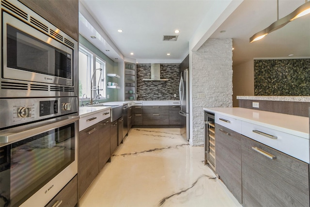 140 Old Farm Rd S, Pleasantville, NY 10570 - kitchen featuring appliances with stainless steel finishes, modern cabinets, light countertops, dark brown cabinetry, and recessed lighting