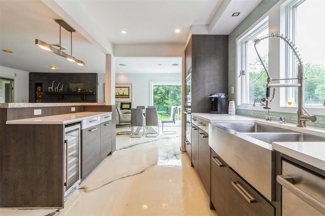140 Old Farm Rd S, Pleasantville, NY 10570 - kitchen featuring modern cabinets, healthy amount of natural light, stainless steel dishwasher, wine cooler, and recessed lighting