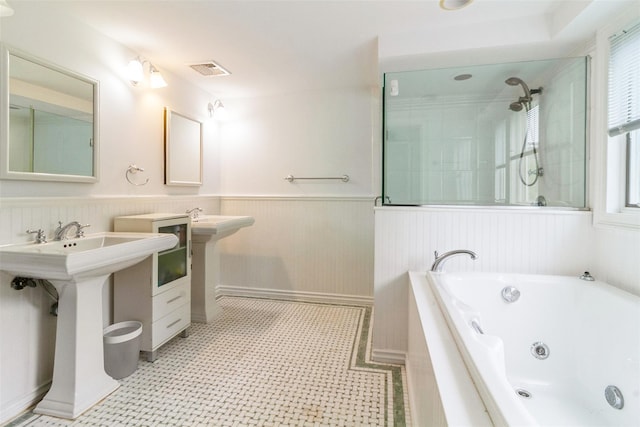 140 Old Farm Rd S, Pleasantville, NY 10570 - full bathroom featuring a tub with jets, wainscoting, a shower, and tile patterned floors
