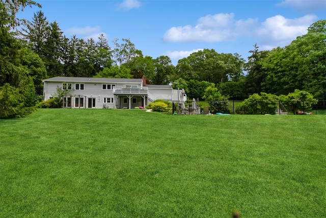 140 Old Farm Rd S, Pleasantville, NY 10570 - rear view of property with a deck, a chimney, and view of scattered trees