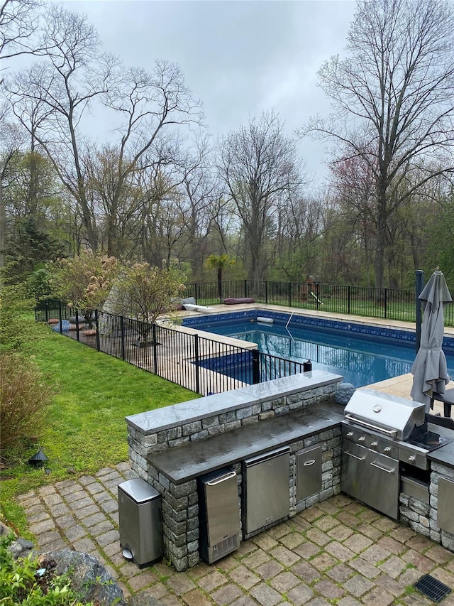 140 Old Farm Rd S, Pleasantville, NY 10570 - view of pool with an outdoor kitchen, a fenced backyard, and a patio area