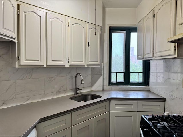 1505 Archer Rd Unit 6B, Bronx, NY 10462 - kitchen with tasteful backsplash, black gas range, and light countertops