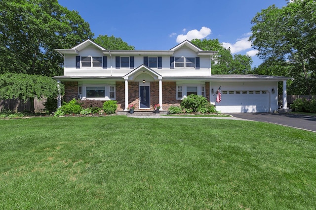 113 Pine St, Port Jefferson Station, NY 11776 - view of front of property with a garage, driveway, and brick siding