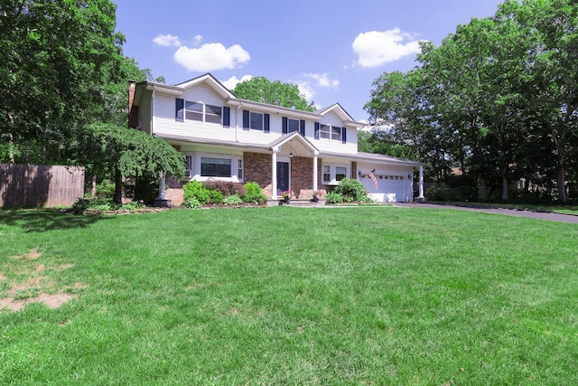 113 Pine St, Port Jefferson Station, NY 11776 - view of front of home with asphalt driveway, an attached garage, brick siding, and a chimney