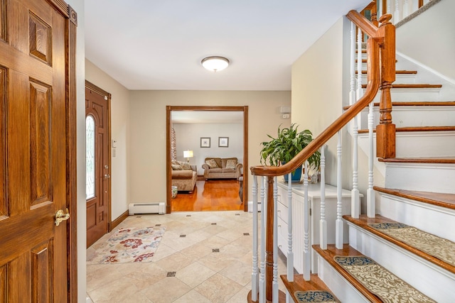 113 Pine St, Port Jefferson Station, NY 11776 - foyer featuring a baseboard radiator, stairs, and light tile patterned flooring