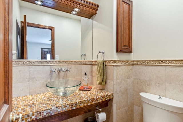 113 Pine St, Port Jefferson Station, NY 11776 - bathroom with tile walls and a wainscoted wall