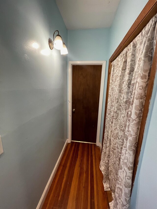 126 Tanglewylde Rd, Lake Peekskill, NY 10579 - doorway featuring dark wood-type flooring and baseboards