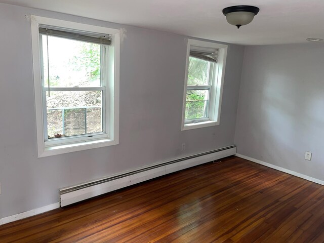 126 Tanglewylde Rd, Lake Peekskill, NY 10579 - empty room featuring baseboard heating and wood finished floors