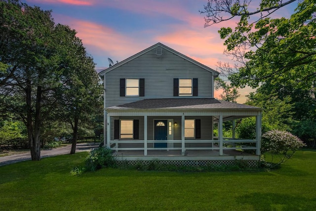 4 Cooks Ln, Westhampton, NY 11977 - view of front of house with covered porch, a yard, and roof with shingles