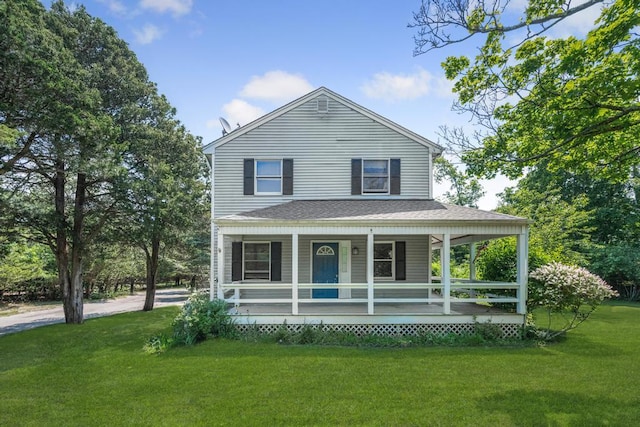 4 Cooks Ln, Westhampton, NY 11977 - farmhouse inspired home with a porch, a front yard, and a shingled roof