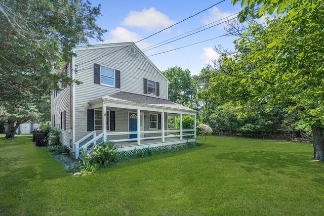 4 Cooks Ln, Westhampton, NY 11977 - view of front facade with a porch and a front lawn